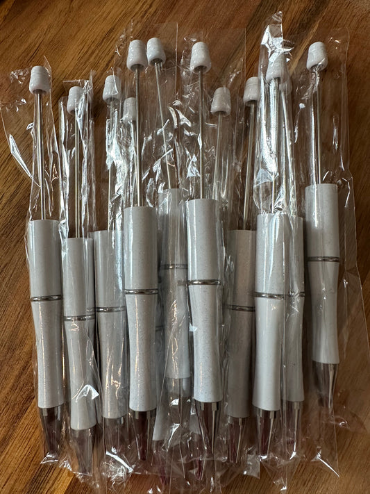 White sparkly plastic pens (wholesale).